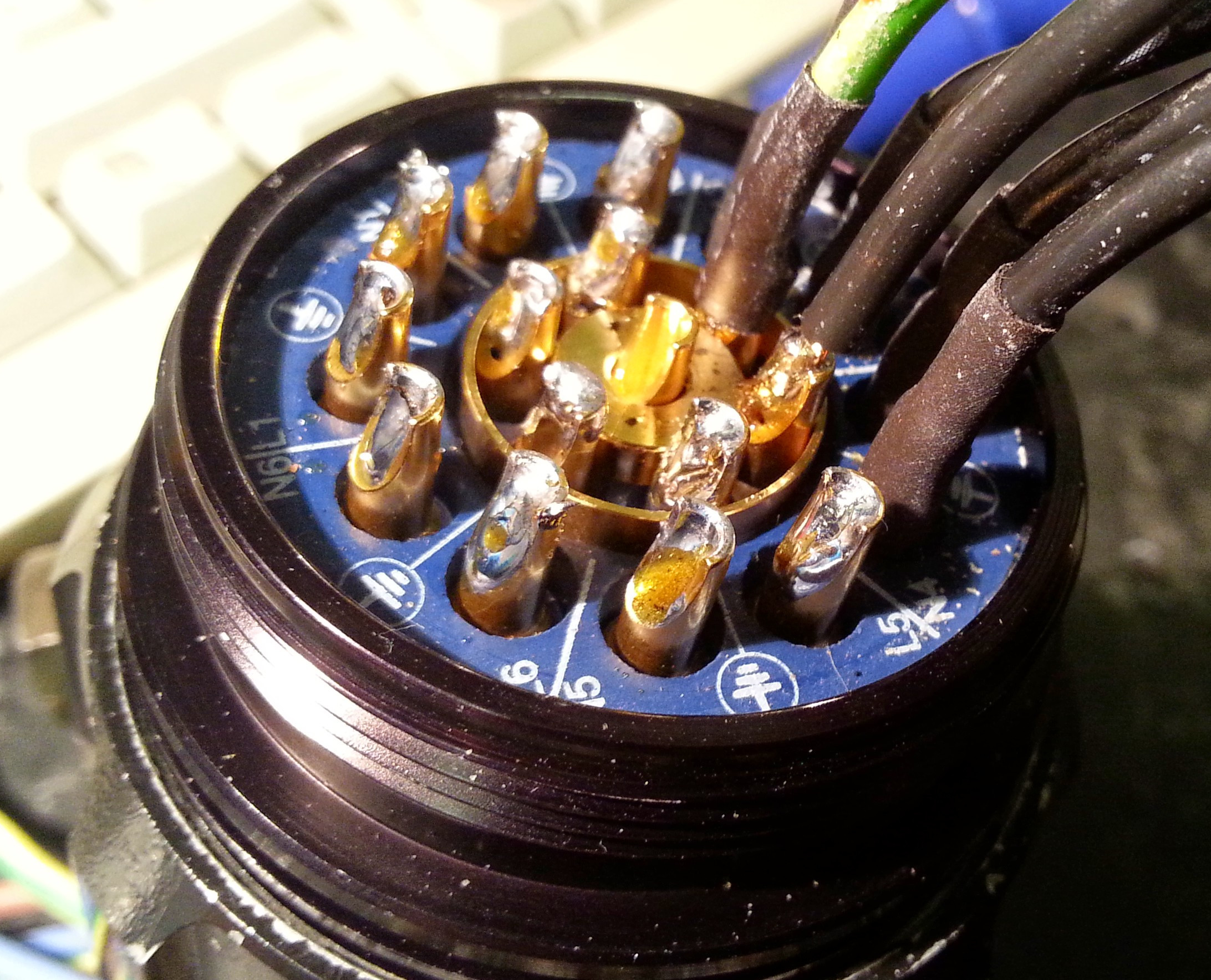 Rear view of socket during soldering process.